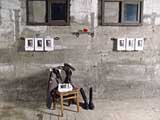 Marsha Pels, Cleansing III: Toilette, 2001, uniform, gun holster, boots, chair, set of 7 Hitler hand towels, soap