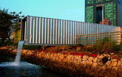 Norbert Francis Attard, Container 21st.c., 2003, 40ft container, 2 pumps, pvc pipes, water, light, silver paint, Ocean Terminal, Kaohsiung,Taiwan
