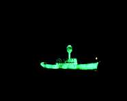 Dorothy Cross, Ghost Ship, 1999, Documentation of Nissan Art Project in association with IMMA, 1999: two light ship models, phosphorescent paint, and u.v. lights, DVD, 10 mins, looped, 90 x 38 x 18 cm, Collection Irish Museum of Modern Art, Purchase
