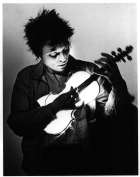 Anderson Playing the Neon Bow, 1983, black and white photograph from 'United States, 1-4' at Brooklyn Academy of Music, Brooklyn, NY.