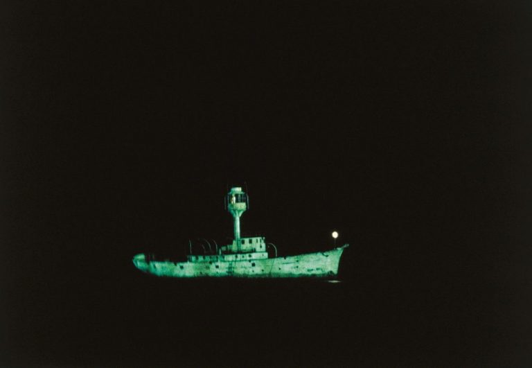 Gallery thumbnail. Dorothy Cross, Ghost Ship, 1999. Two light ship models, phosphorescent paint, ultraviolet lights, video. 10 min loop. IMMA Collection: Purchase, 2003
