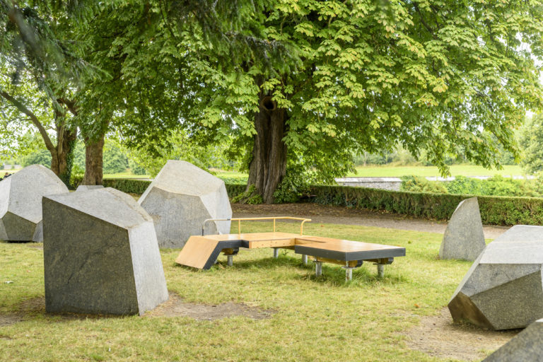 Gallery thumbnail. Forerunner, Y O U N G F O S S I L, 2021. Installation views of artwork re-staged for IMMA Outdoors 2022. Seating Structures - wood, steel, sawdust, dragon's blood, resin, paper, fabric. Commissioned by IMMA for IMMA Outdoors 2021. Supported by Public Service Innovation Fund. Presented with the kind support of OPW. Photography Louis Haugh.
